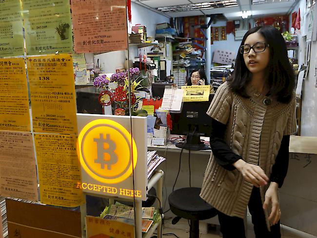 Eine Reisebüro in Hongkong, das Bitcoins akzeptiert: Zwei US-Börsen wolle künftig Bitcoin-Preise veröffentlichen und damit die Transparenz um die Digitalwährung verbessern. (Symbolbild)