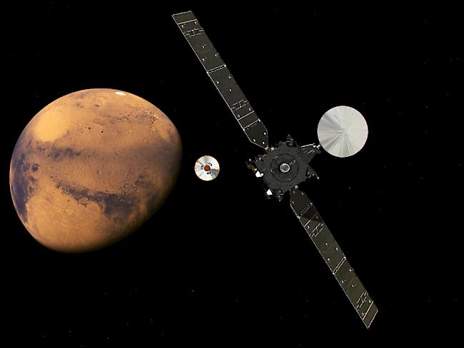 "Schiaparelli" vor der Explosion bei der Landung auf dem Mars - Abkoppelung von der Muttersonde. (künstlerische Darstellung durch die ESA)