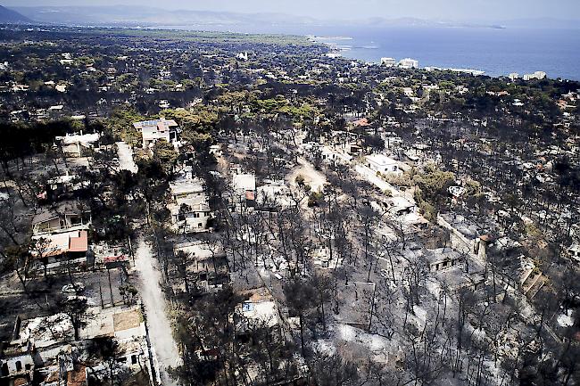 Verheerend. Die Waldbrände rund um Athen haben bislang 83 Todesopfer gefordert.
